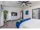 Spacious bedroom featuring wood-look floors, large windows, and a comfortable sitting area at 756 E Appaloosa Rd, Gilbert, AZ 85296