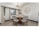 The dining area features a modern light fixture and a round table set with six chairs, perfect for Gathering meals at 756 E Appaloosa Rd, Gilbert, AZ 85296