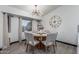 Charming dining room with a round wood table, seating for six, and a modern chandelier at 756 E Appaloosa Rd, Gilbert, AZ 85296