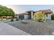 Single-story home featuring xeriscape desert landscaping and mature trees at 756 E Appaloosa Rd, Gilbert, AZ 85296