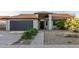 Charming single-story home with xeriscape, desert landscaping, and inviting entrance at 756 E Appaloosa Rd, Gilbert, AZ 85296