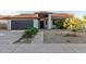 Charming single-story home with xeriscape, desert landscaping, and inviting entrance at 756 E Appaloosa Rd, Gilbert, AZ 85296