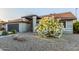 Single-story home featuring xeriscape desert landscaping and mature trees at 756 E Appaloosa Rd, Gilbert, AZ 85296