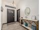 Bright entryway with decorative console table, mirror, and modern light fixture at 756 E Appaloosa Rd, Gilbert, AZ 85296