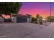 Charming single-story home featuring an expansive driveway, mature trees, and well-kept landscaping at 756 E Appaloosa Rd, Gilbert, AZ 85296