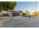 Charming single-story home featuring an expansive driveway, mature trees, and well-kept landscaping at 756 E Appaloosa Rd, Gilbert, AZ 85296