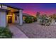 Charming single-story home featuring a lush flowering bushes, desert landscaping, and inviting entryway, enhancing curb appeal at 756 E Appaloosa Rd, Gilbert, AZ 85296