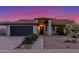 Charming single-story home featuring a well-maintained lawn, two car garage and inviting entrance at 756 E Appaloosa Rd, Gilbert, AZ 85296