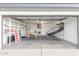 Spacious garage featuring laundry, storage cabinets, and recreational equipment at 756 E Appaloosa Rd, Gilbert, AZ 85296