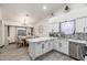 Bright and stylish kitchen with white cabinetry, marble countertops, and stainless steel appliances, ideal for cooking at 756 E Appaloosa Rd, Gilbert, AZ 85296