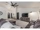 Bright living room featuring vaulted ceilings, a gray sectional, and a stylish entertainment center at 756 E Appaloosa Rd, Gilbert, AZ 85296