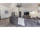 Comfortable living room showcasing a large gray sectional, vaulted ceilings, and ample natural light at 756 E Appaloosa Rd, Gilbert, AZ 85296