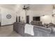 Spacious living room boasts stylish decor, hard floors, and a comfortable sectional sofa for relaxing and entertaining at 756 E Appaloosa Rd, Gilbert, AZ 85296