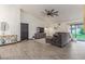 Spacious living room with vaulted ceilings, stylish decor, and sliding glass doors to yard at 756 E Appaloosa Rd, Gilbert, AZ 85296