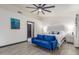 Bright main bedroom with a plush blue settee, decorative headboard and neutral decor at 756 E Appaloosa Rd, Gilbert, AZ 85296
