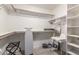 This walk-in closet provides ample space for storage, with shelving and hanging areas throughout at 756 E Appaloosa Rd, Gilbert, AZ 85296