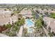 Expansive aerial view of a residential neighborhood, pool, and landscaped surroundings at 8100 E Camelback Rd # 143, Scottsdale, AZ 85251