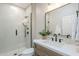 Modern bathroom with sleek fixtures, a glass-enclosed shower, and a wood vanity at 8100 E Camelback Rd # 143, Scottsdale, AZ 85251