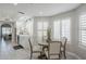 Cozy breakfast nook with bright light and wooden table with seating for four in a modern kitchen at 8100 E Camelback Rd # 143, Scottsdale, AZ 85251