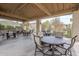 Community outdoor seating area with multiple tables and chairs for residents at 8100 E Camelback Rd # 143, Scottsdale, AZ 85251