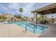 Community pool with a covered patio area and lounge chairs for residents' enjoyment at 8100 E Camelback Rd # 143, Scottsdale, AZ 85251