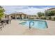 Community pool with an outdoor dining area, shallow area and landscaped surroundings at 8100 E Camelback Rd # 143, Scottsdale, AZ 85251