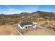 An aerial view showcases this desert home, surrounded by natural vegetation at 8147 E Redberry --, Mesa, AZ 85207