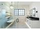 Elegant bathroom showcasing a soaking tub, shower, chandelier and sleek vanity at 8147 E Redberry --, Mesa, AZ 85207