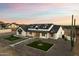 Aerial view of a luxurious, modern farmhouse with manicured landscaping and a private driveway at 8147 E Redberry --, Mesa, AZ 85207