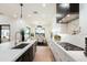 Bright open kitchen featuring stainless steel appliances, gas cooktop, and white marble countertops at 8147 E Redberry --, Mesa, AZ 85207