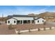 Rear of the home showing desert landscaping, and spiral staircase at 8147 E Redberry --, Mesa, AZ 85207