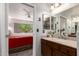 Bathroom with a bedroom view, granite countertops, a large mirror, and stylish fixtures at 9735 N 94Th Pl # 110, Scottsdale, AZ 85258