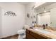 Bathroom vanity with granite countertop and bronze fixtures at 9735 N 94Th Pl # 110, Scottsdale, AZ 85258