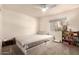 Neutral bedroom with a ceiling fan and window at 9735 N 94Th Pl # 110, Scottsdale, AZ 85258