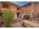 Charming condo exterior featuring desert landscaping and staircase to upper units at 9735 N 94Th Pl # 110, Scottsdale, AZ 85258