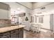 Open kitchen flowing into the dining area and featuring granite countertops and tiled flooring at 9735 N 94Th Pl # 110, Scottsdale, AZ 85258