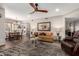 Spacious living room with a dining area and kitchen view, featuring a ceiling fan at 9735 N 94Th Pl # 110, Scottsdale, AZ 85258