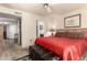 Bright main bedroom with a ceiling fan, large window, and warm, inviting ambiance at 9735 N 94Th Pl # 110, Scottsdale, AZ 85258