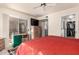 Main bedroom featuring a ceiling fan, sliding glass doors to an outdoor patio, and closet access at 9735 N 94Th Pl # 110, Scottsdale, AZ 85258