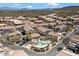 Wide aerial showcasing a desert community with homes, landscaping, a community pool and views of the surrounding mountains at 9750 N Monterey Dr # 50, Fountain Hills, AZ 85268