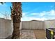 Paver patio in fenced backyard with palm tree and AC unit at 10631 N 15Th Way # 4, Phoenix, AZ 85020