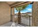 Balcony view featuring a palm tree, black metal railing, and scenic views of the surrounding neighborhood and mountains at 10631 N 15Th Way # 4, Phoenix, AZ 85020