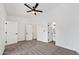 Spacious bedroom featuring a ceiling fan with attached bathroom and closet at 10631 N 15Th Way # 4, Phoenix, AZ 85020