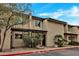 Inviting exterior of the townhome with desert landscaping and private entry, under a clear blue sky at 10631 N 15Th Way # 4, Phoenix, AZ 85020