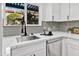 Updated kitchen with stainless steel appliances, white cabinets, and sleek countertops at 10631 N 15Th Way # 4, Phoenix, AZ 85020