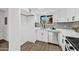 Updated kitchen features white cabinets, stainless steel appliances, and sleek countertops at 10631 N 15Th Way # 4, Phoenix, AZ 85020