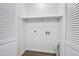 Bright utility room with hook ups and white walls and trim at 10631 N 15Th Way # 4, Phoenix, AZ 85020