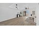 Open-concept living room featuring modern lighting, and view of backyard at 10631 N 15Th Way # 4, Phoenix, AZ 85020