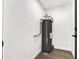 Utility room with laminate floors, water heater and neutral walls at 10631 N 15Th Way # 4, Phoenix, AZ 85020