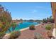Stunning backyard with vibrant landscaping, overlooking a serene canal and neighboring homes at 10913 W Chino Dr, Peoria, AZ 85373